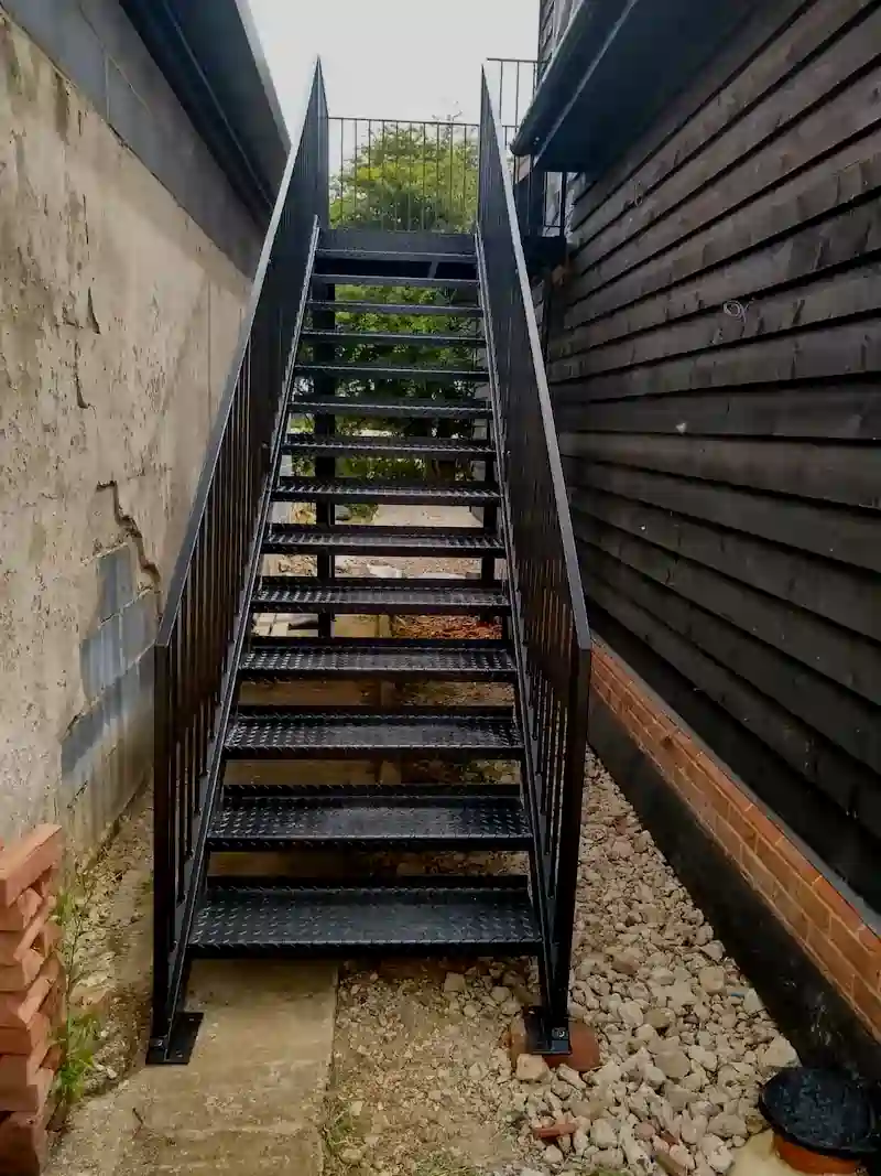 Metal staircase powder coated in satin black by Powderplus, serving Cambridge and East Anglia